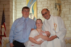 proud and happy parents and Fr. R.  Of course baby S. E., too!